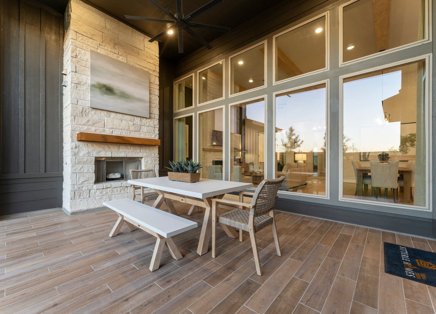 Covered outdoor patio with fireplace in the Teramo model