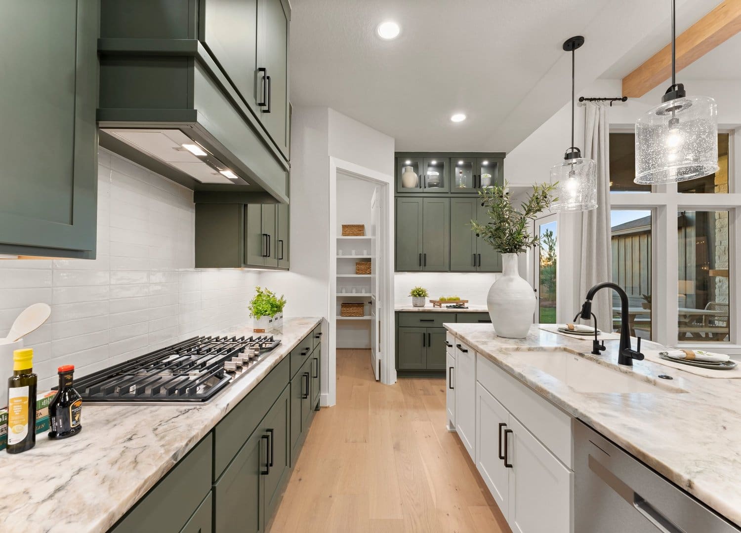 Green and white designer kitchen in the Sitterle Teramo model